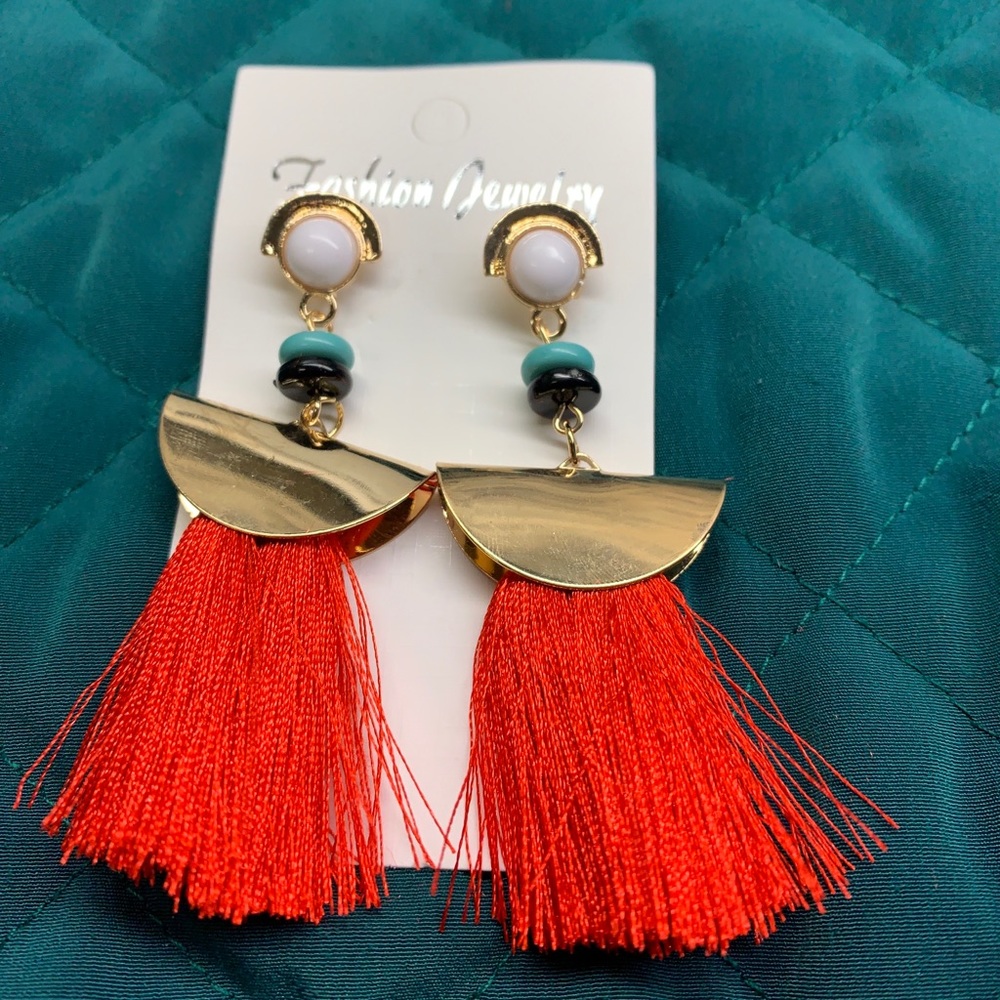Red tassel earrings.